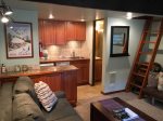 Living area, loft access, and kitchen